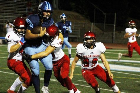 Hayden Abbruzzese withstanding the power of opposing football players.