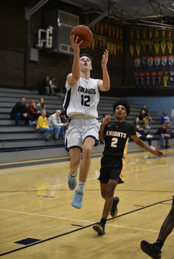 Junior Nathan Greenfield goes up for a layup against the Rio Linda Knights.