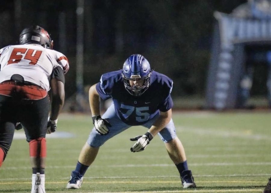 Senior Andrew Richards playing football during the 2019-2020 football season during his junior year.