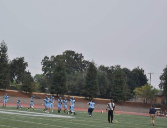 During the Oakmont VS Roseville football game, athletes were playing through the hazy air.