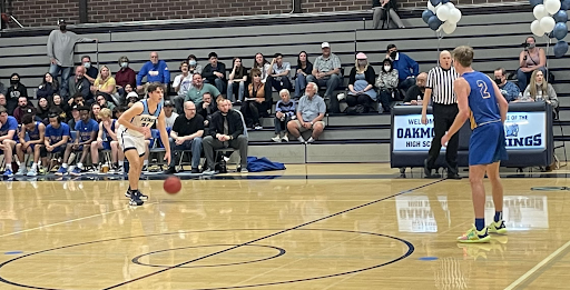 Senior Brent Gill dribbles the ball up the court.
