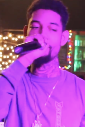 An image captured as PnB Rock performed for a lively crowd in Atlanta in 2016.