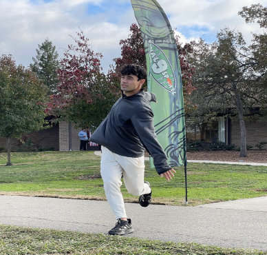 Player Kelly Jew throwing a massive drive during his warm up routine.
