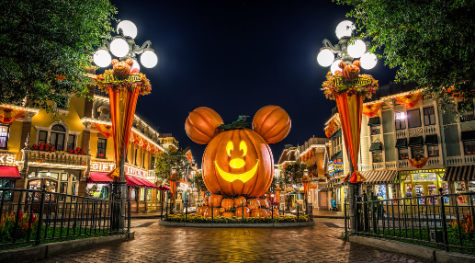 A picture of the front area of Disneyland, also known as Main Street U.S.A, decorated for the Halloween season.
