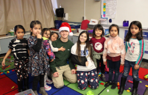 Andi Mededovic and Rachel Eccles with some of the children from FC Joyce during Santas Helpers.