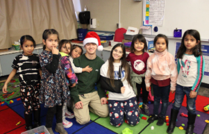 Andi Mededovic and Rachel Eccles with some of the children from FC Joyce during Santa's Helpers.