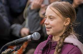 Photo of Thunberg speaking at a different Switzerland protest over the introduction of a railway through the city.
