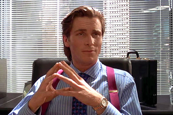 Patrick Bateman sitting like the sophisticated young man he was.