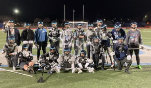 Oakmont’s 2023 boys lacrosse team in uniform on their home field.