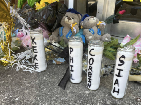 Candle light vigil held for the victims of the shooting, candles with names of four victims are seen in frame.
