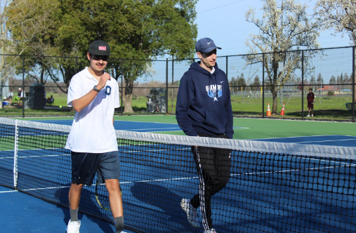 AJ Rodriguez and Mr. Bacchi chat before their game at Woodcreek High School. 
