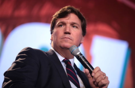 Carlson speaks to an audience at the Student Action Summit 2018, hosted by Turning Point USA.