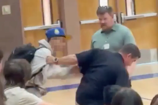 Lincoln High School student and staff getting to physical altercation on gym floor PC: New York Post
