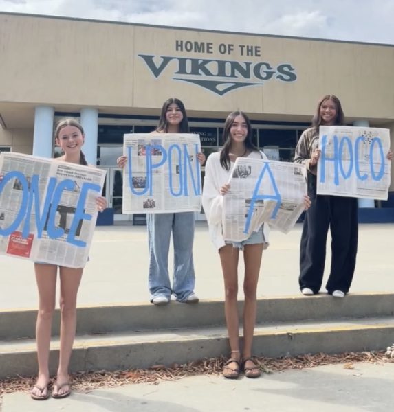 Oakmont ASB reps holding newspapers spelling "Once Upon A Hoco" PC: @theoakmontway