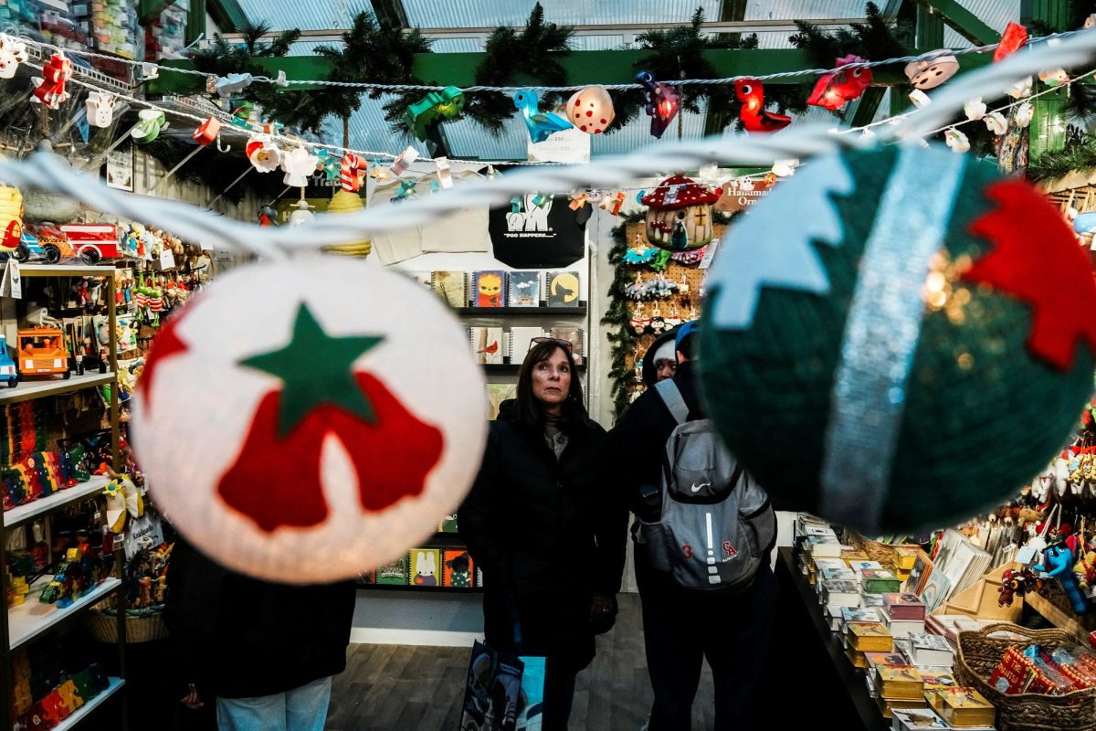 People visit a Christmas store in a holiday market featuring artisans from around the world at Bryant Park in New York City, U.S., November 16, 2025. REUTERS/Eduardo Munoz
