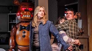 An image of the movie’s main cast along with a spooky animatronic in the background. PC: IMDb

