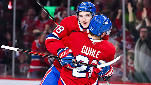Lane Huston of MTL celebrating with Kaiden Guhle after his OT game-winner in game three of round one against TBL. PC: NHL.com
