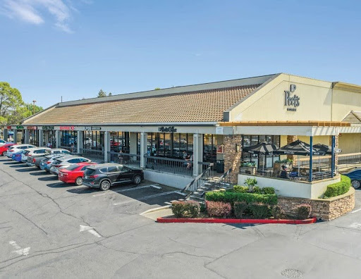 One of the mini-malls on Cirby Way, with OMG!Yogurt, Pete’s Coffee and the Bel Air Grocery Store. PC: LoopNet
